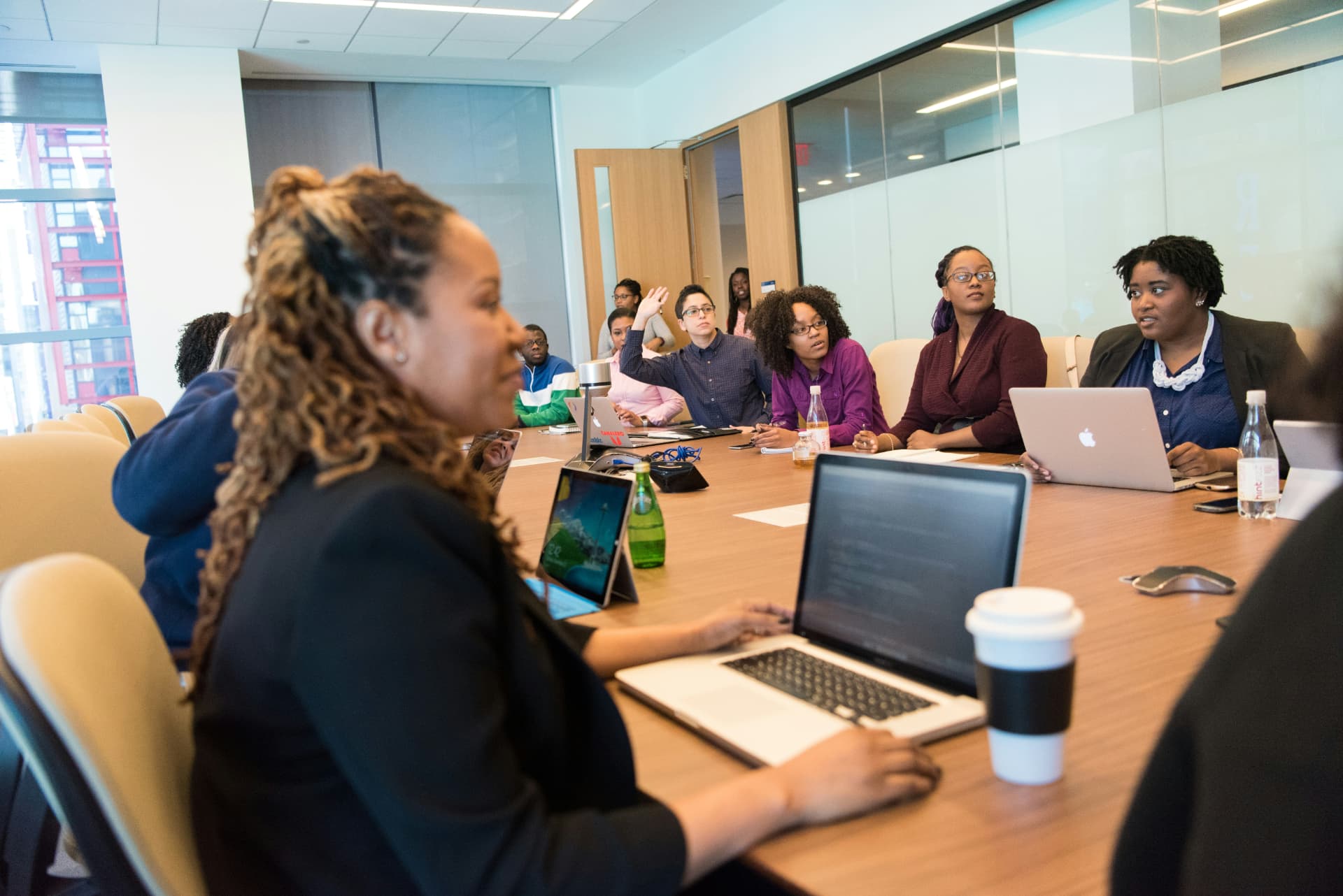 Leaders in a boardroom discussion during a facilitated strategy session